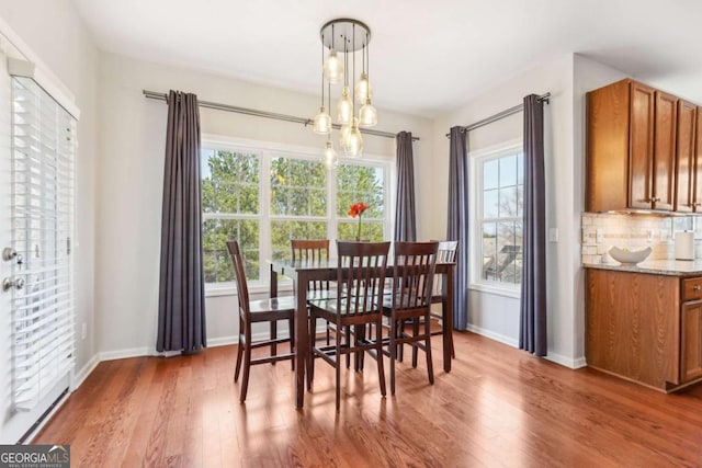 dining area with dark hardwood / wood-style flooring