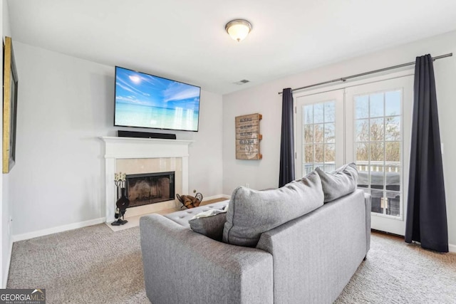 carpeted living room featuring lofted ceiling and a healthy amount of sunlight