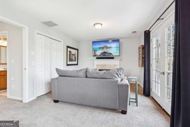 living room featuring light colored carpet