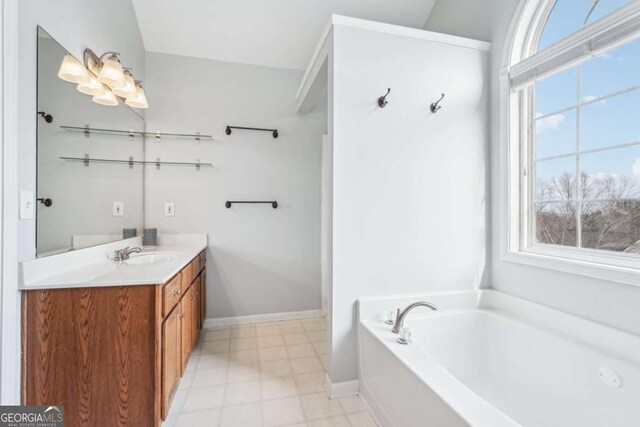 bathroom featuring plus walk in shower, a wealth of natural light, and vanity