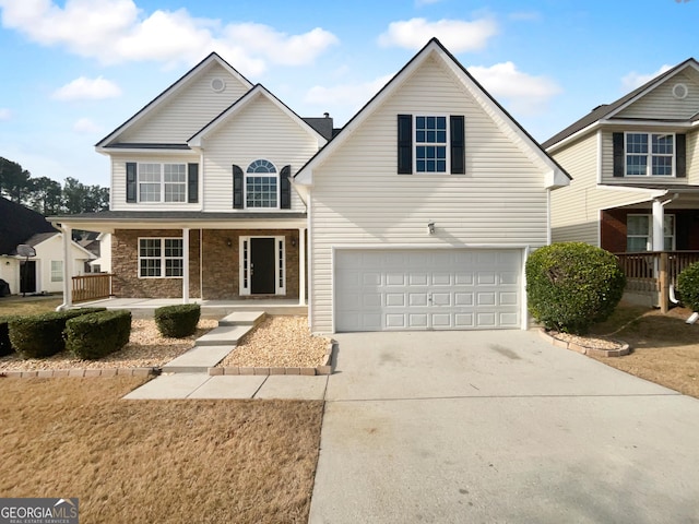 front facade featuring a garage and covered porch