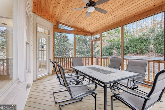 sunroom / solarium featuring wood ceiling, ceiling fan, and vaulted ceiling