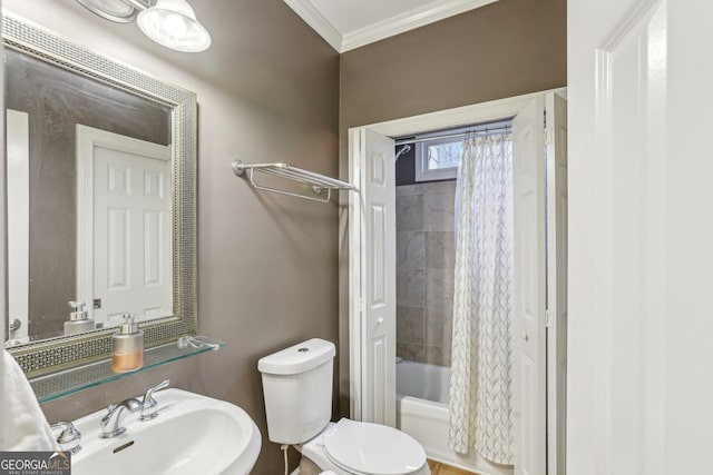 full bathroom with sink, crown molding, shower / bath combo, and toilet