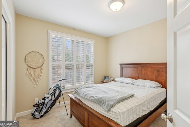 bedroom with light carpet