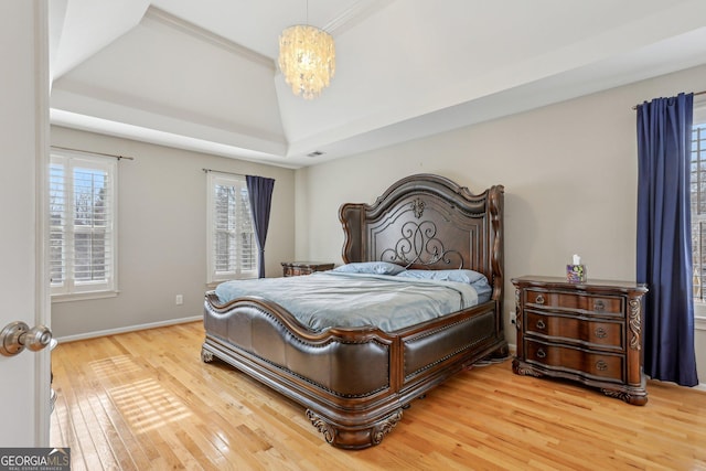 bedroom with wood-type flooring and a chandelier