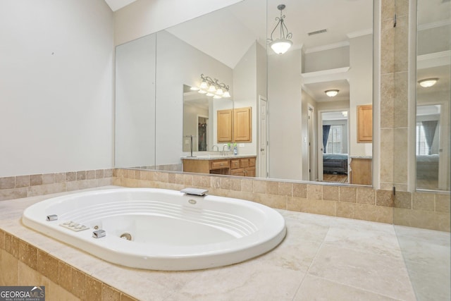 bathroom with crown molding, vanity, tiled bath, and high vaulted ceiling