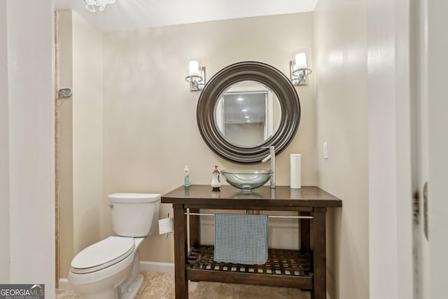 bathroom featuring sink and toilet