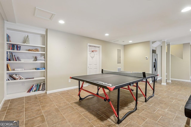 game room featuring light tile patterned floors and built in shelves