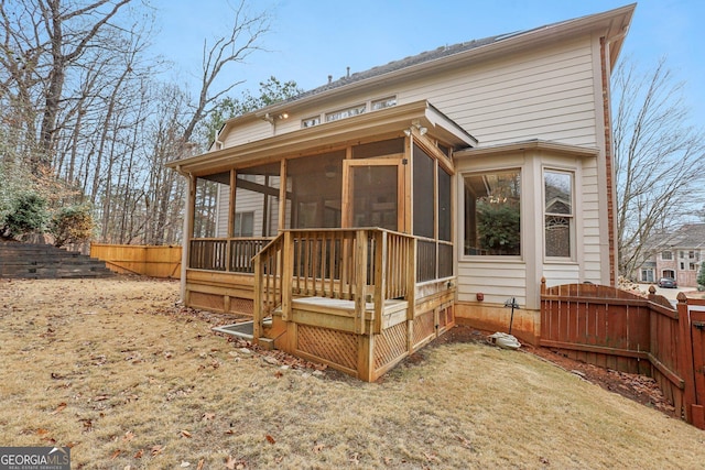 back of property featuring a sunroom