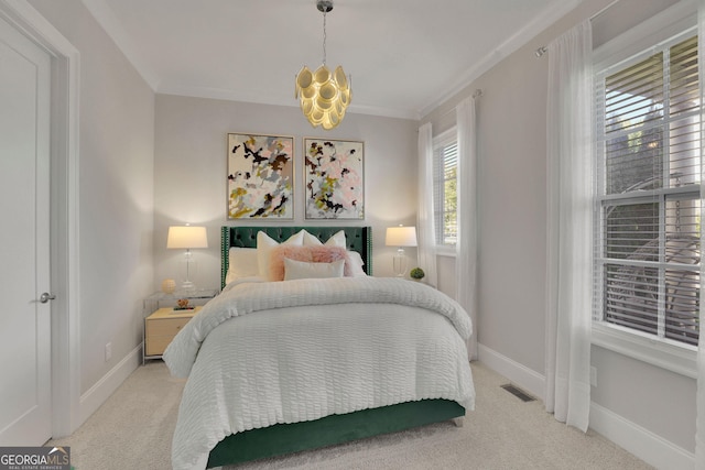 bedroom with carpet floors, crown molding, and an inviting chandelier