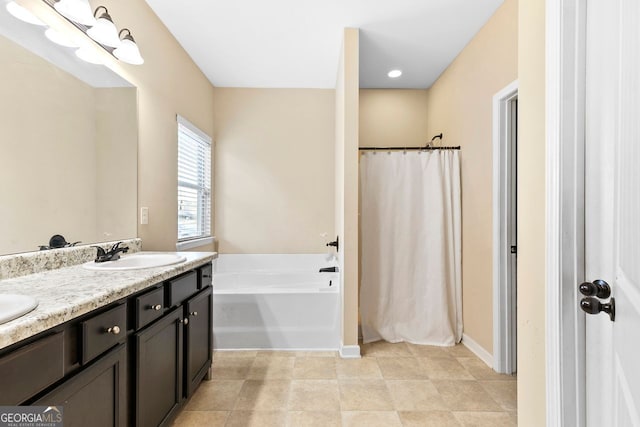 bathroom with vanity and a tub to relax in