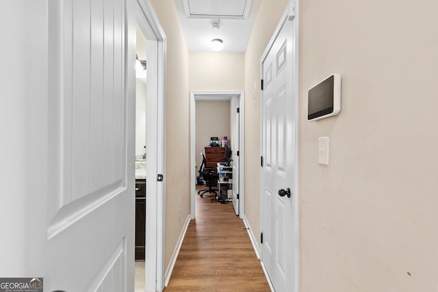 hall with light hardwood / wood-style floors