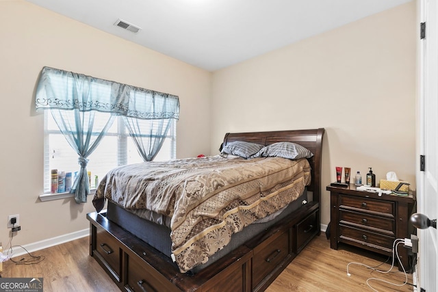 bedroom with light hardwood / wood-style floors
