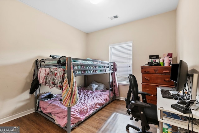 bedroom featuring hardwood / wood-style flooring