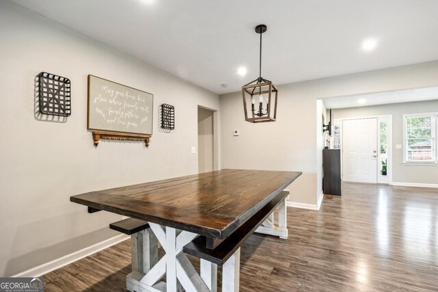 dining area with dark hardwood / wood-style floors