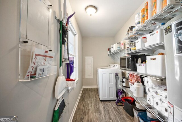 washroom with wood-type flooring and separate washer and dryer