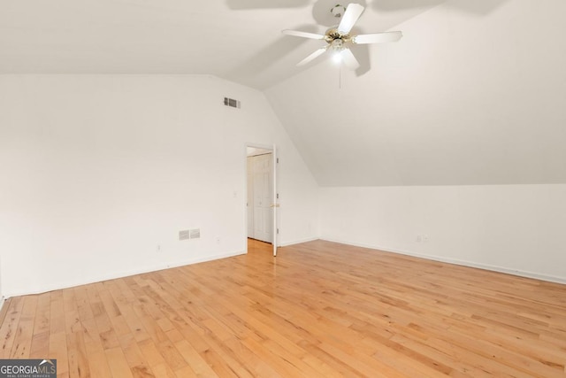 bonus room with vaulted ceiling, ceiling fan, light wood-type flooring, and visible vents