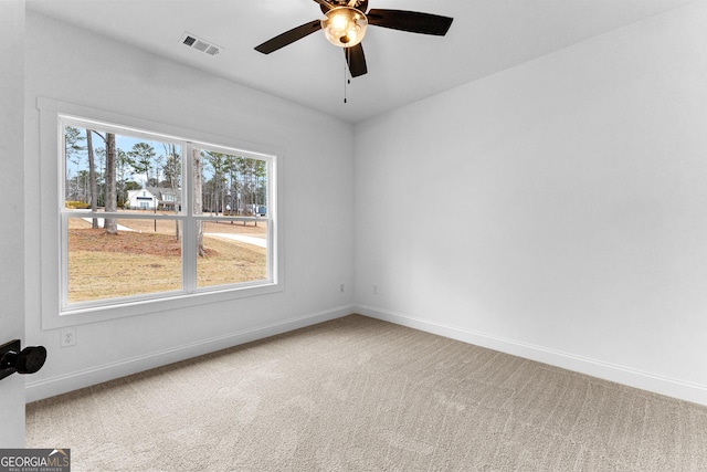 unfurnished room featuring carpet floors and ceiling fan