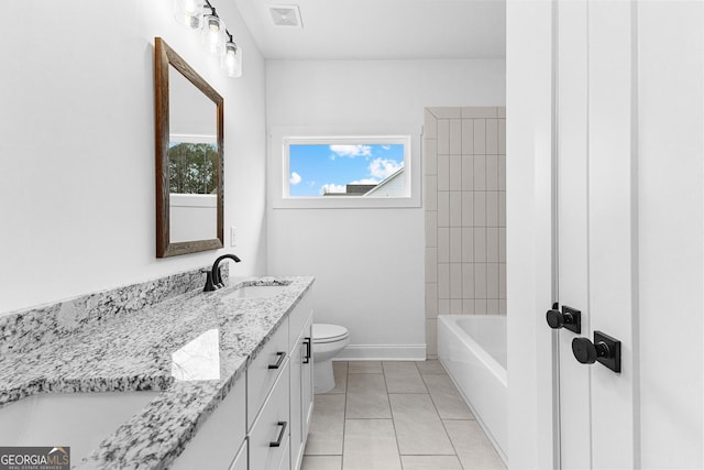 bathroom featuring tile patterned flooring, vanity, and toilet