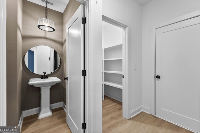 bathroom featuring hardwood / wood-style flooring