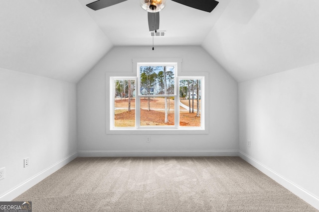 bonus room with carpet floors, ceiling fan, and vaulted ceiling