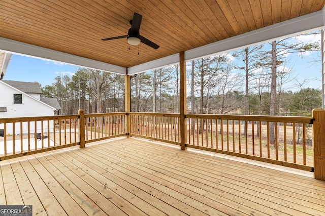 wooden deck featuring ceiling fan