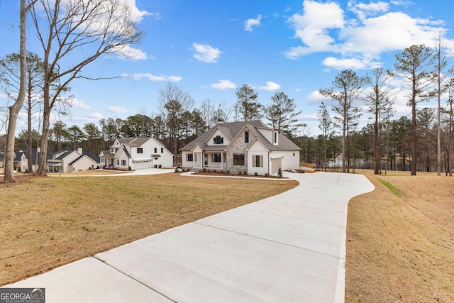 view of front of home with a garage and a front yard