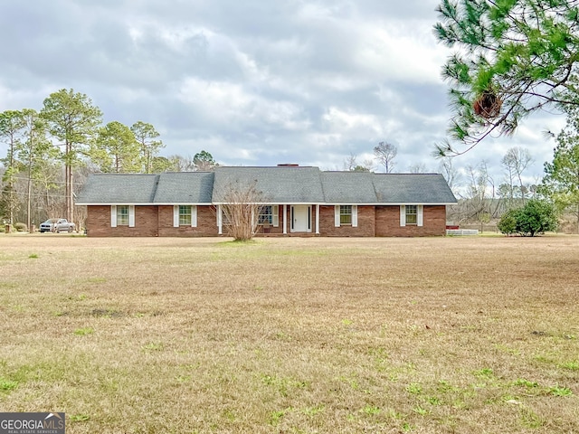 ranch-style home with a front lawn