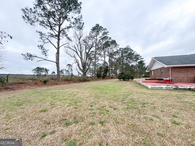 view of yard featuring a deck