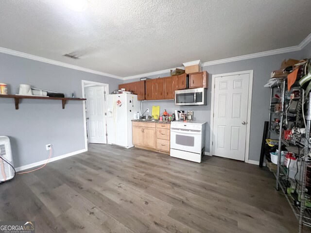 kitchen featuring ornamental molding, dark hardwood / wood-style floors, a textured ceiling, and white appliances