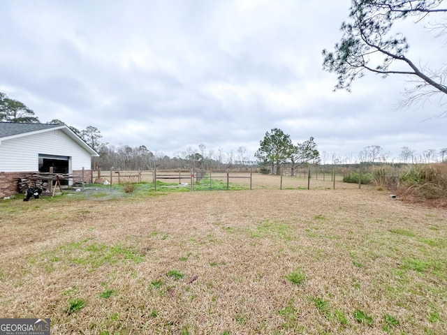 view of yard with a rural view