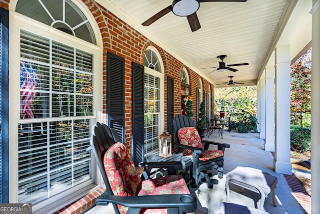 view of patio with ceiling fan and a porch