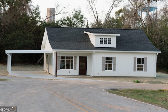 view of front of home with a carport