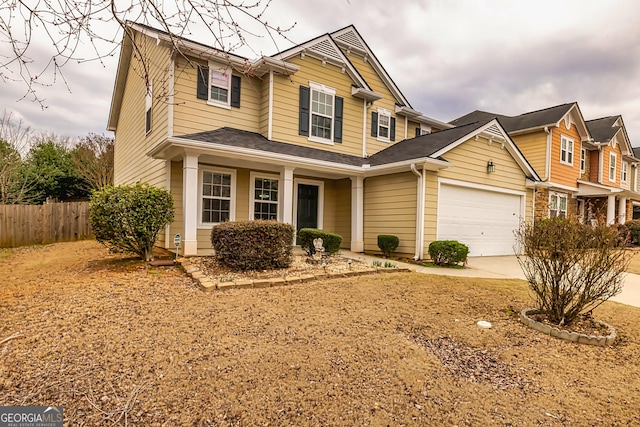 view of front of property featuring a garage and a porch