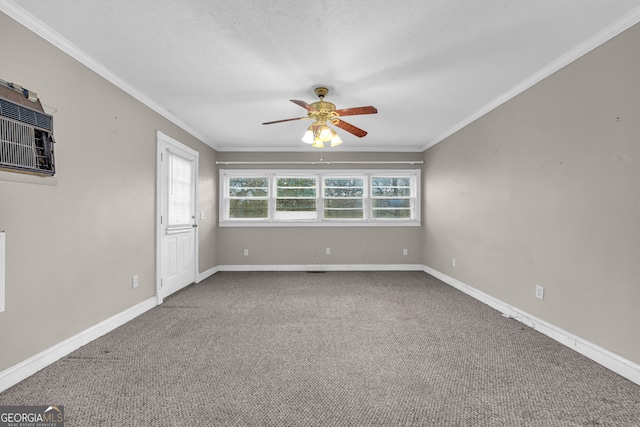 empty room with ceiling fan, crown molding, a textured ceiling, and carpet