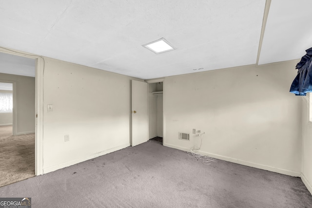 unfurnished room featuring light colored carpet