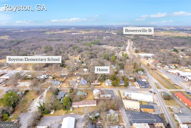view of property location featuring a heavily wooded area