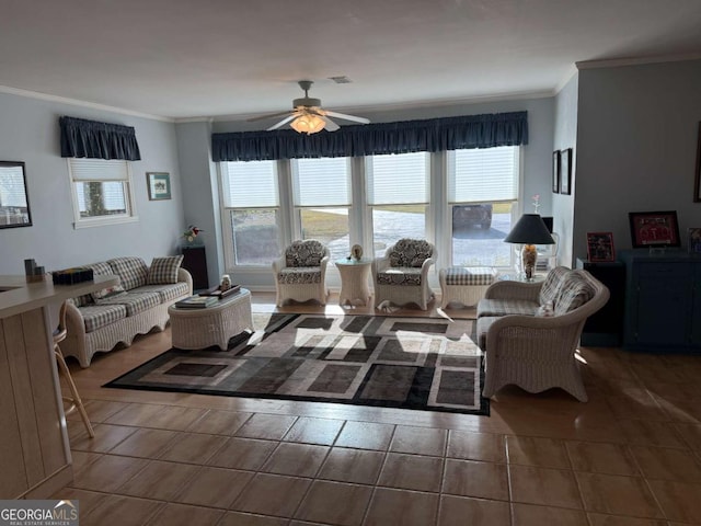 tiled living area with ornamental molding, plenty of natural light, visible vents, and a ceiling fan