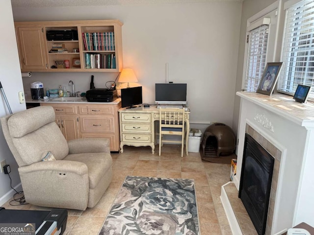 interior space featuring light tile patterned floors and a tiled fireplace