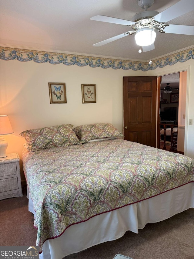 carpeted bedroom featuring a closet and a ceiling fan