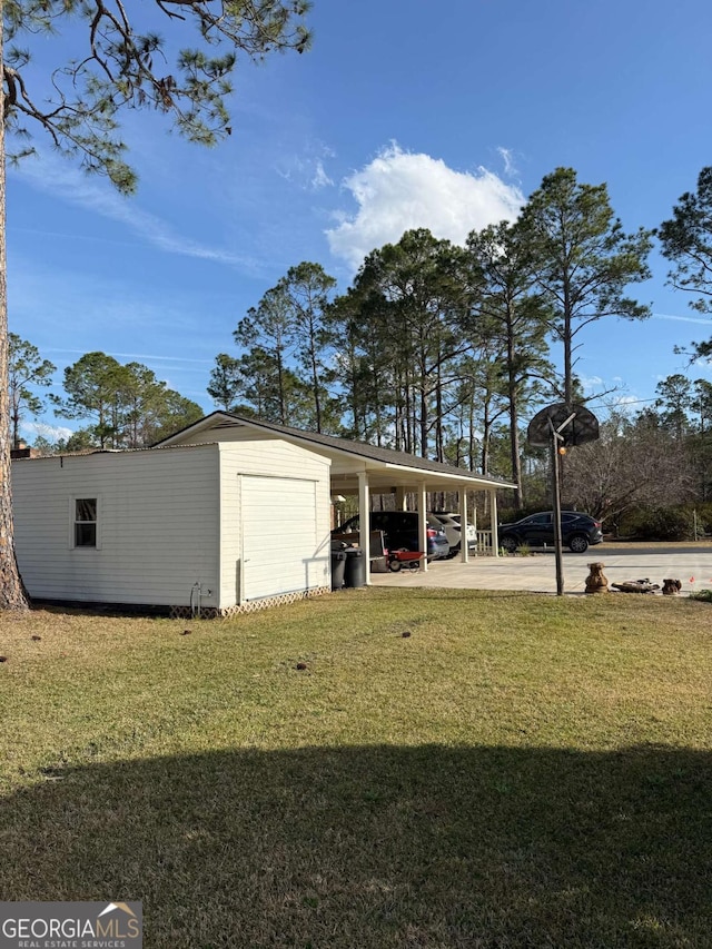 view of outbuilding featuring an outbuilding and a carport