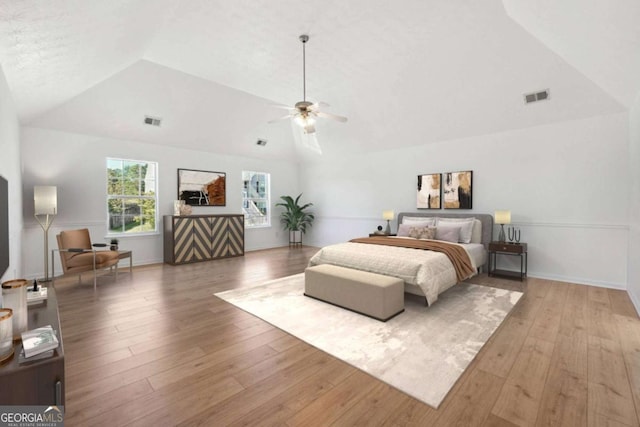 bedroom with vaulted ceiling, wood-type flooring, and ceiling fan