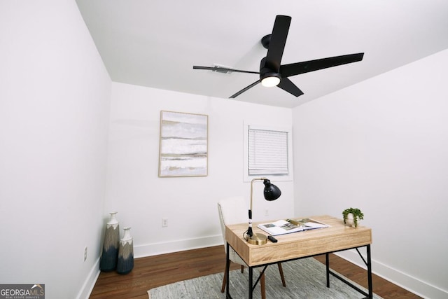 office with ceiling fan and dark hardwood / wood-style flooring