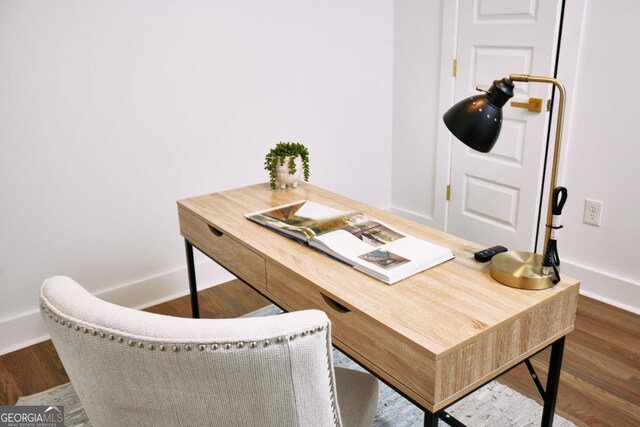 home office featuring dark hardwood / wood-style flooring