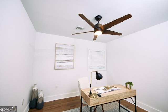 office space with dark hardwood / wood-style floors and ceiling fan