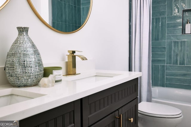 full bathroom featuring vanity, shower / bathtub combination with curtain, and toilet