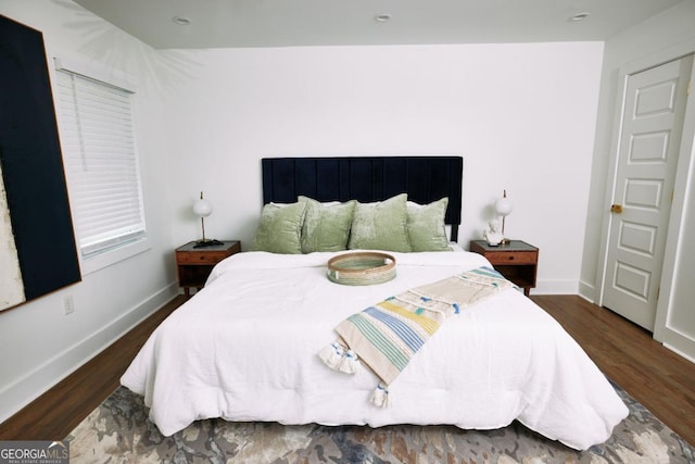 bedroom featuring dark hardwood / wood-style floors