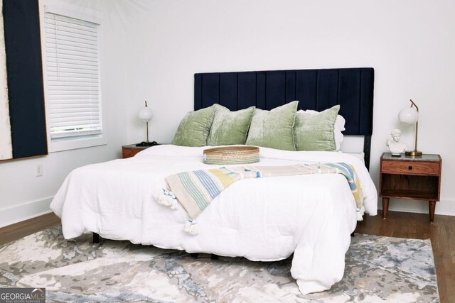 bedroom featuring dark hardwood / wood-style floors