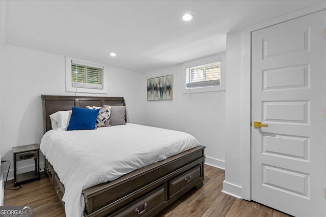 bedroom featuring dark hardwood / wood-style flooring