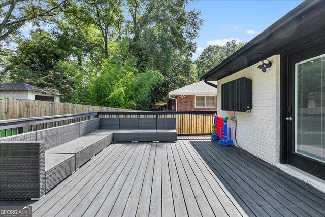 deck featuring outdoor lounge area